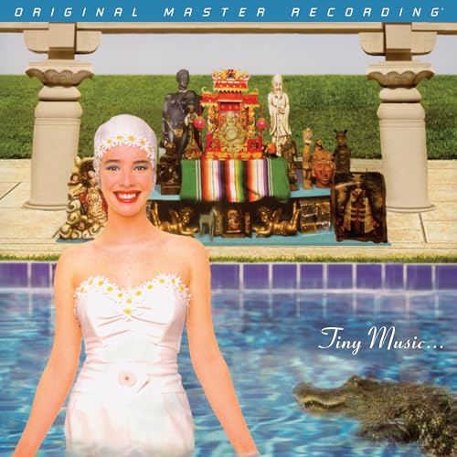 Stone Temple Pilots album cover: woman, statues, pool, and alligator.