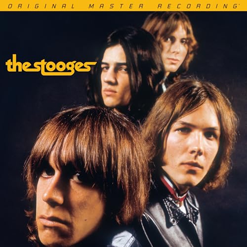 The Stooges band portrait on a dark blue album cover.
