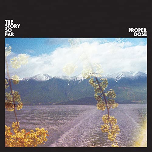 Album cover showing a lake, snowy mountains, and yellow flowers with text overlay.