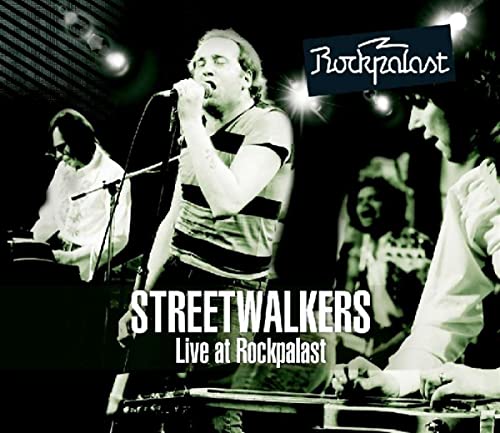 Black and white photo of Streetwalkers performing live on stage.