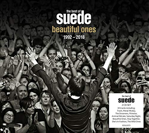 "Black and white image of a man with raised arms, surrounded by a cheering crowd."