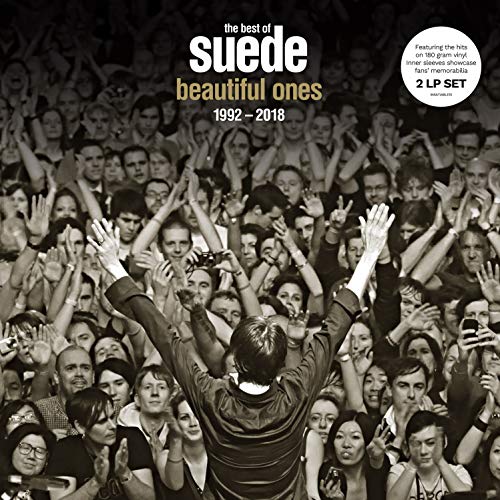 Black and white vinyl album cover with a man standing in a crowd.