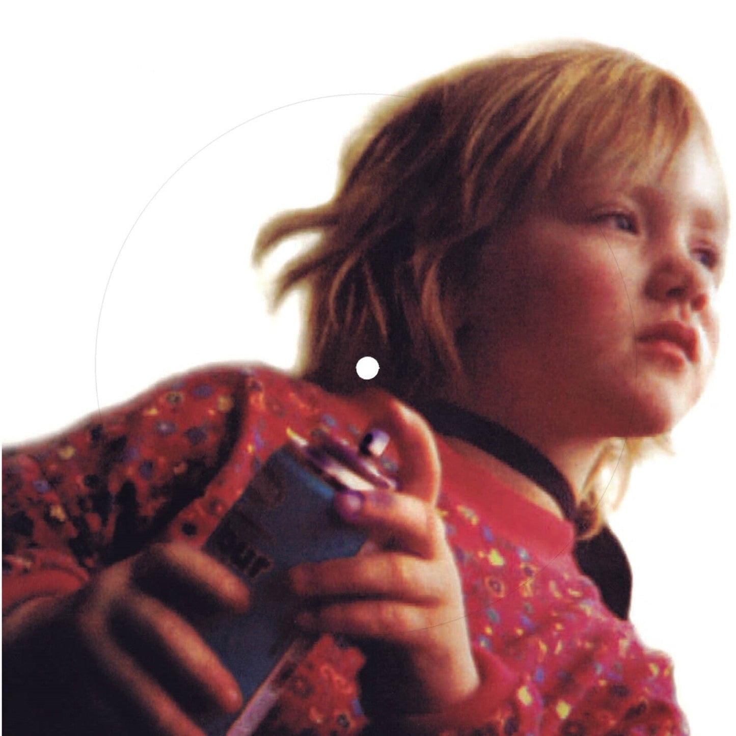 Vinyl record cover featuring a portrait of a young boy with dreadlocks.
