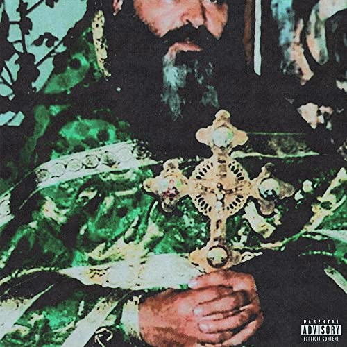 Bearded man with a golden cross, green and black background.