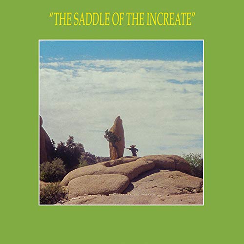 Album cover: desert landscape with rock formations and a figure.
