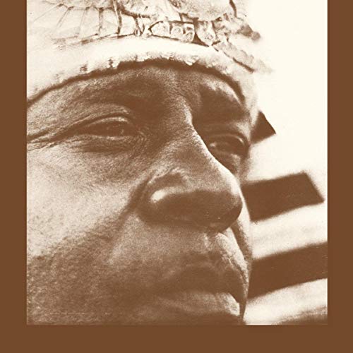 Close-up, sepia-toned portrait of Sun Ra wearing a distinctive hat.
