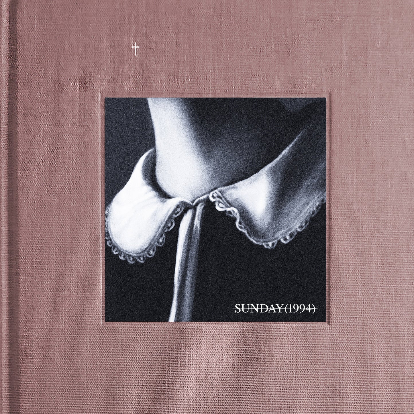 Black and white album cover with a close-up of a person’s collar.