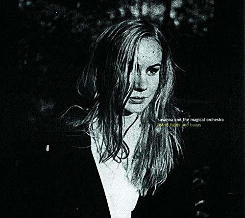 CD cover: woman with long hair, dark background, text overlay.