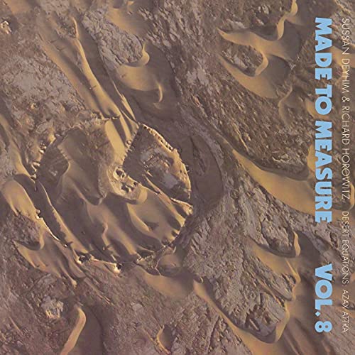 CD cover with abstract desert landscape and bold blue text.
