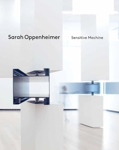 White architectural forms with a blurred figure in the background.