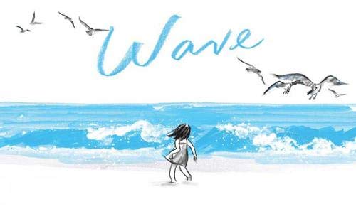 A girl stands on a beach facing the ocean with seagulls flying overhead.
