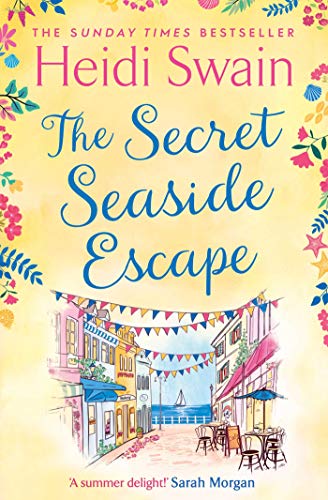 Book cover: āThe Secret Seaside Escapeā with a coastal town illustration.