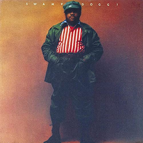 Swamp Dogg album cover: portrait of a man in green and red clothing.