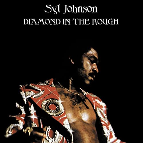 Syl Johnson album cover, portrait of a man in a sparkly jacket.