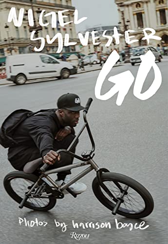Book cover: BMX rider Nigel Sylvester on a city street.