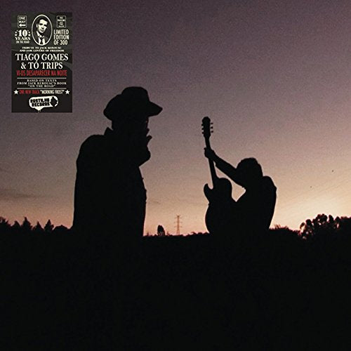Vinyl record cover featuring silhouetted musicians against a sunset sky.