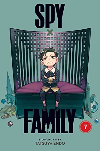 A manga cover with a boy sitting on a chair surrounded by various objects.