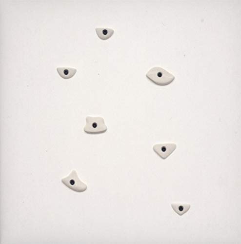 White album cover with scattered, abstract eye shapes and black pupils.