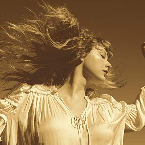 Taylor Swift on “Fearless (Taylor’s Version)” CD cover, golden tones.