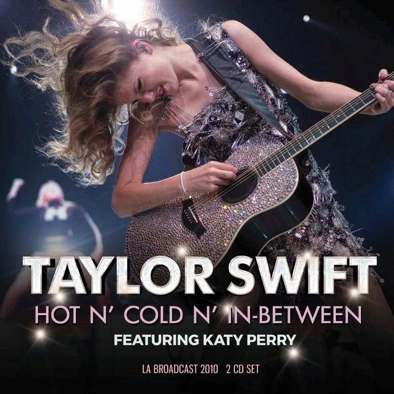 Taylor Swift playing a rhinestone-covered acoustic guitar on stage with text overlay.