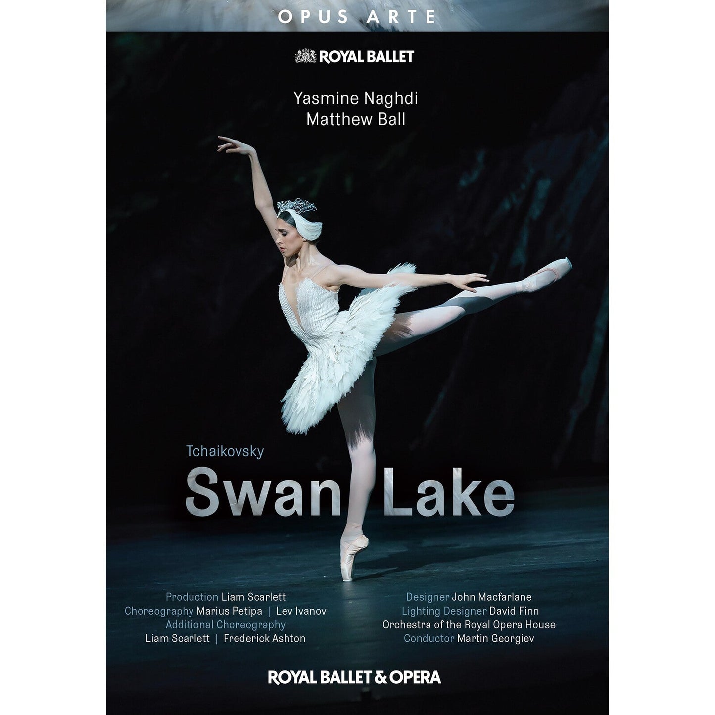 A ballerina in a white tutu performs on stage for a Royal Ballet production.