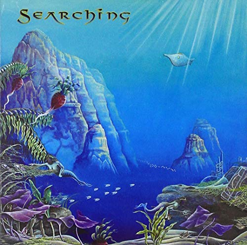 The image depicts an underwater scene with a mermaid, rocks, and seaweed. "Album cover art: mermaid in underwater scene with rocks, seaweed, and the word 'Searching'."