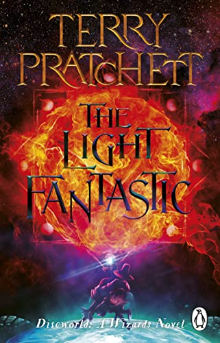 Book cover: “The Light Fantastic” by Terry Pratchett, fiery nebula background.