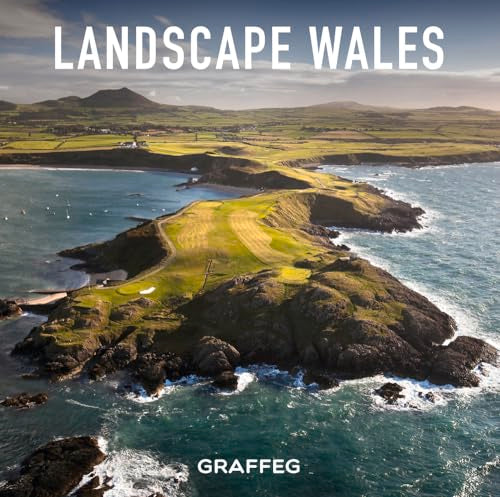 Aerial view of a green Welsh coastal landscape with rocky cliffs.