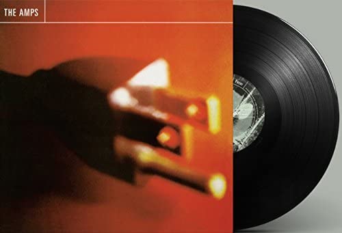 The Amps’ “Pacer” vinyl record with a blurred orange and black cover.