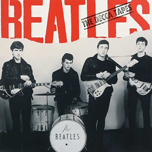 Black and white photo of The Beatles with instruments, album cover.