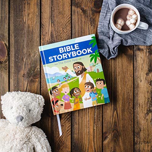 Children’s Bible storybook with Jesus illustration, teddy bear, and hot cocoa.