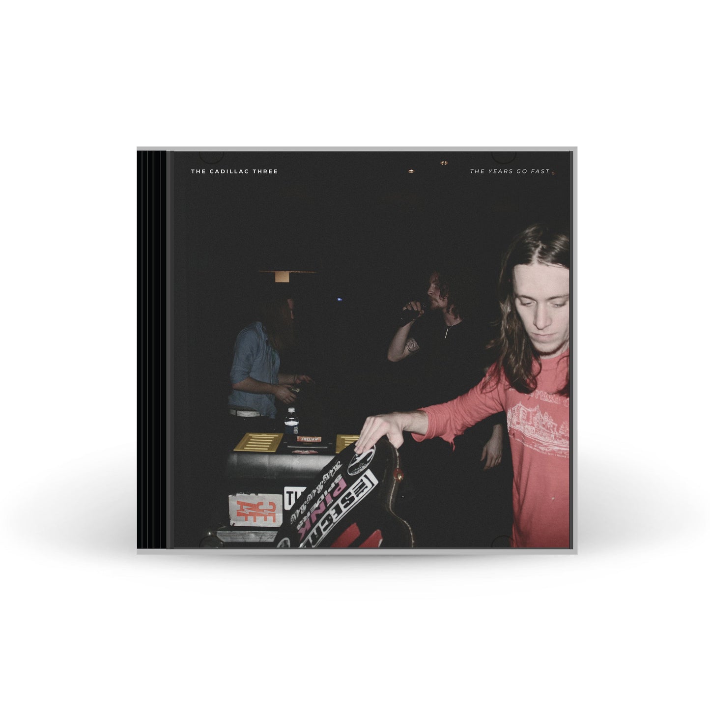 CD cover for The Cadillac Three’s “The Years Go Fast,” showing a dimly lit scene.