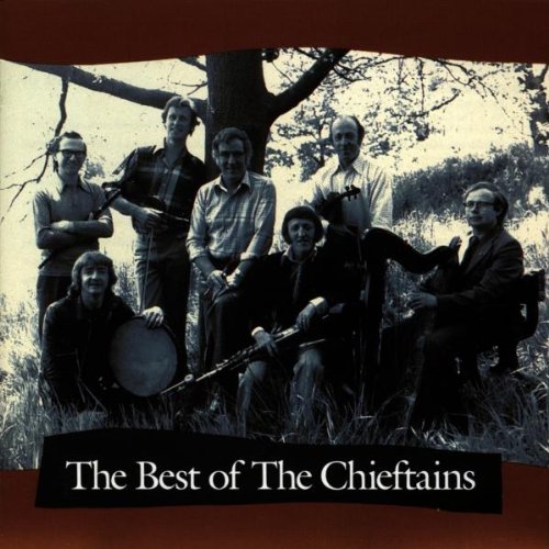 Black and white photo of six musicians, The Chieftains, with instruments.