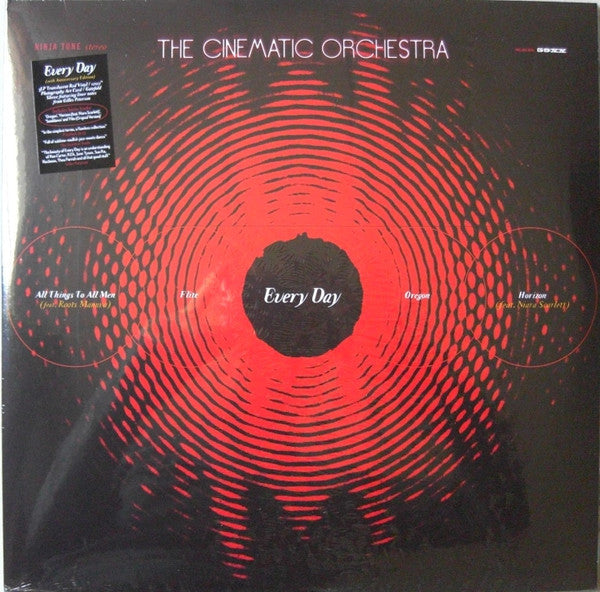 Vinyl record of The Cinematic Orchestra’s “Every Day” with red spiral design.