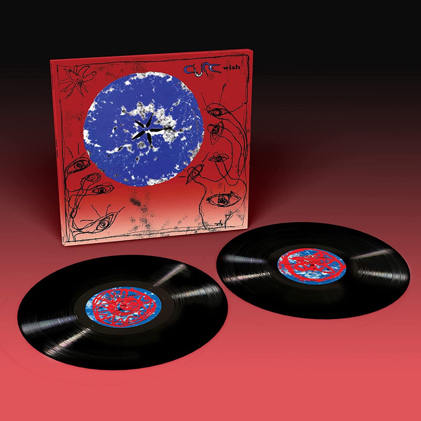 Two vinyl records and album cover with red background and blue circle design.