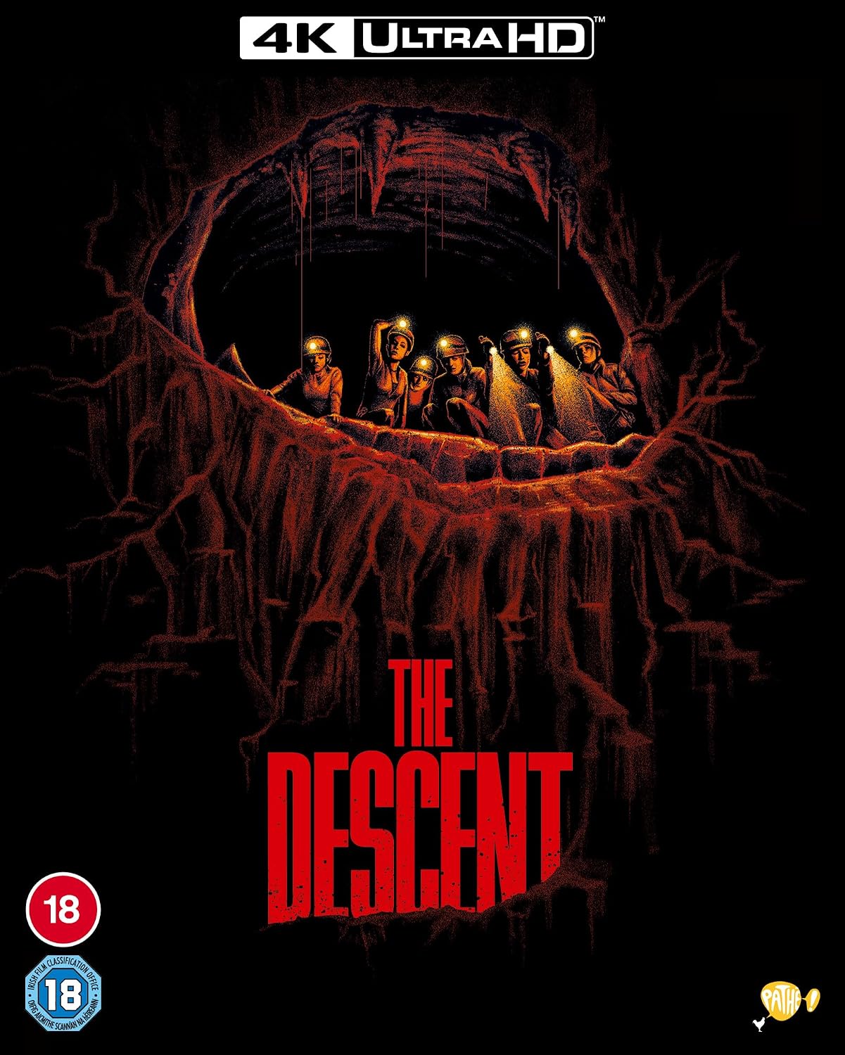 Movie poster for "The Descent" showing cavers in a dark cave.