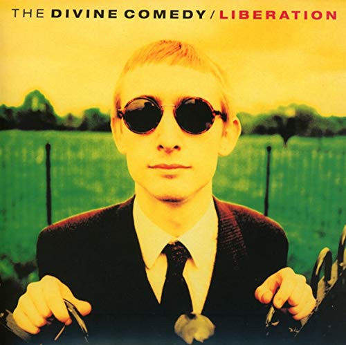 CD cover: man in suit and sunglasses, yellow and green background.