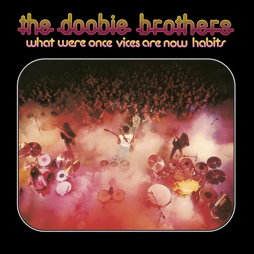 The Doobie Brothers album cover with band performing before a crowd.
