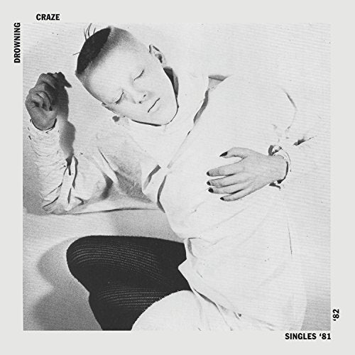 Black and white vinyl album cover with a man in a white shirt.