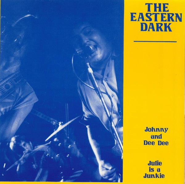 Record cover: singer with microphone on blue and yellow background.