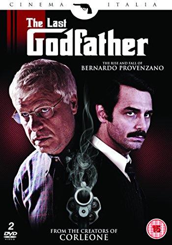 Two men in dark clothing on a DVD cover with handcuffs and smoke.