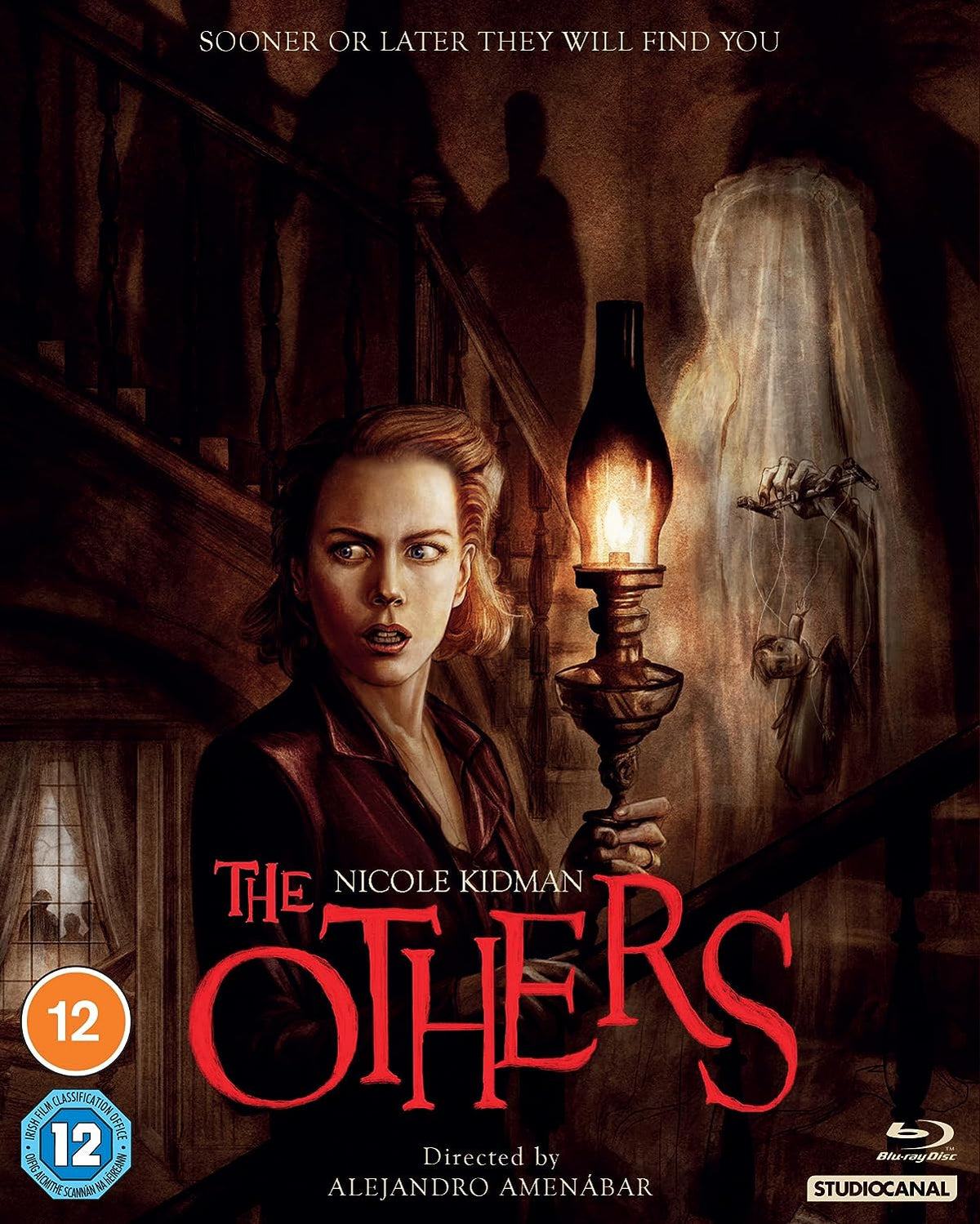 "The Others" Blu-ray cover featuring a woman holding a lantern, with a ghostly figure.