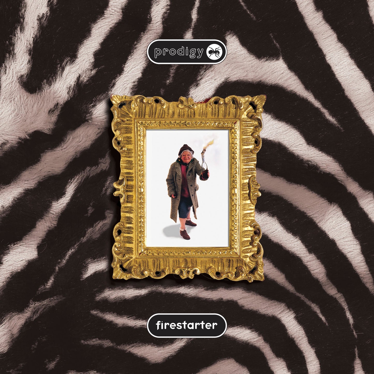 Vinyl album cover for The Prodigy’s “Firestarter” with framed portrait.