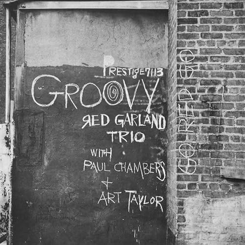 Black and white photo of a vinyl record cover with handwritten text.