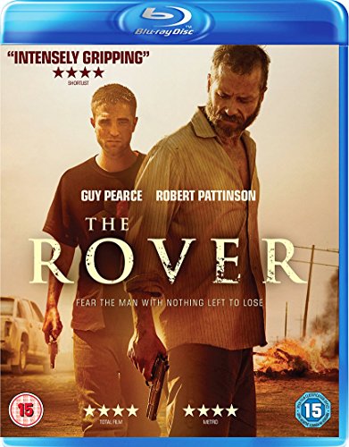 Blu-ray cover for The Rover featuring Guy Pearce and Robert Pattinson in a desert.