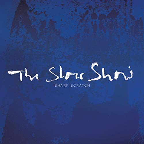 Blue vinyl record cover with white handwritten-style text: "The Slow Show.