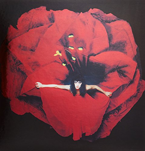Red poppy flower with a person’s face and arms within the petals.
