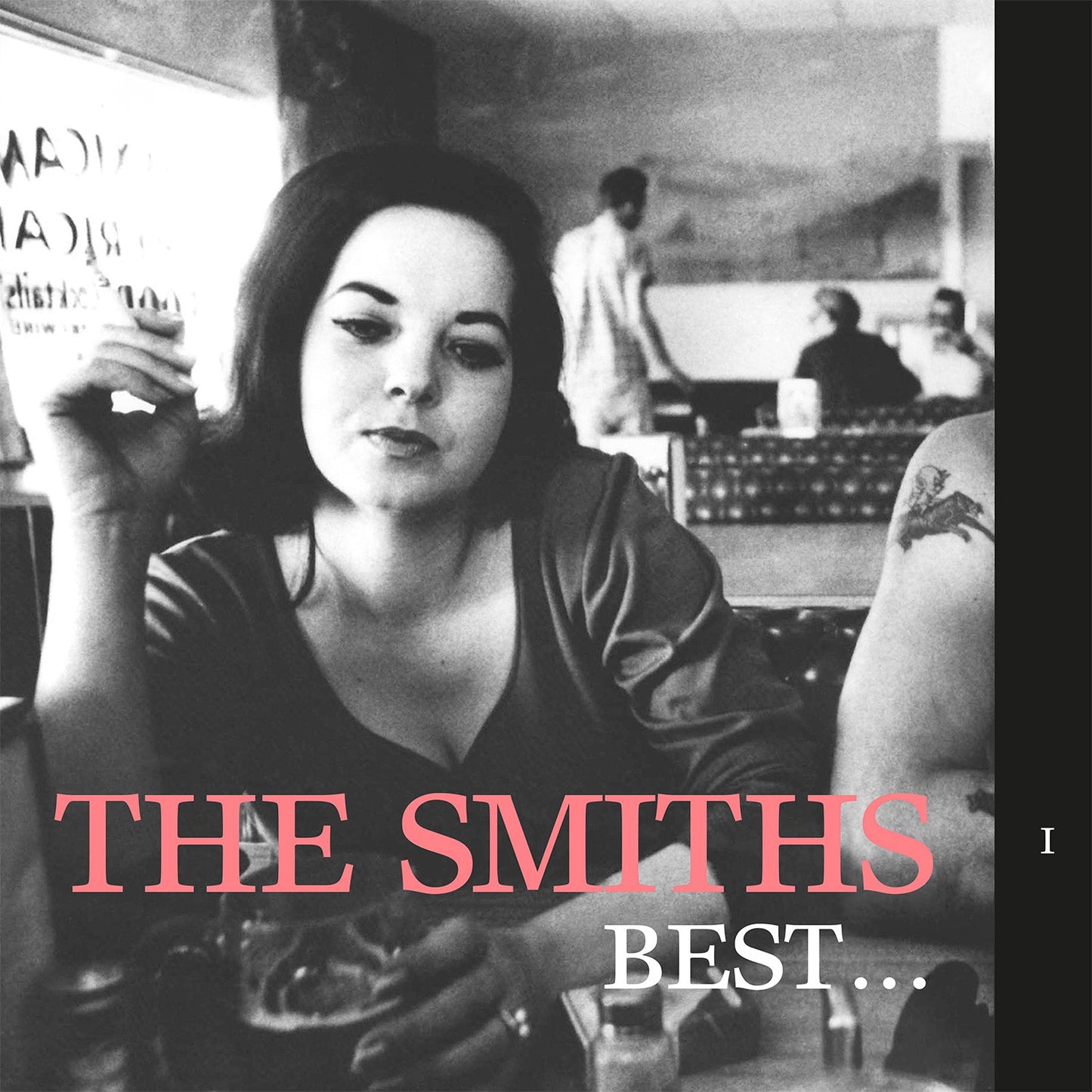 Black and white album cover featuring a woman and text: "The Smiths Best... I".