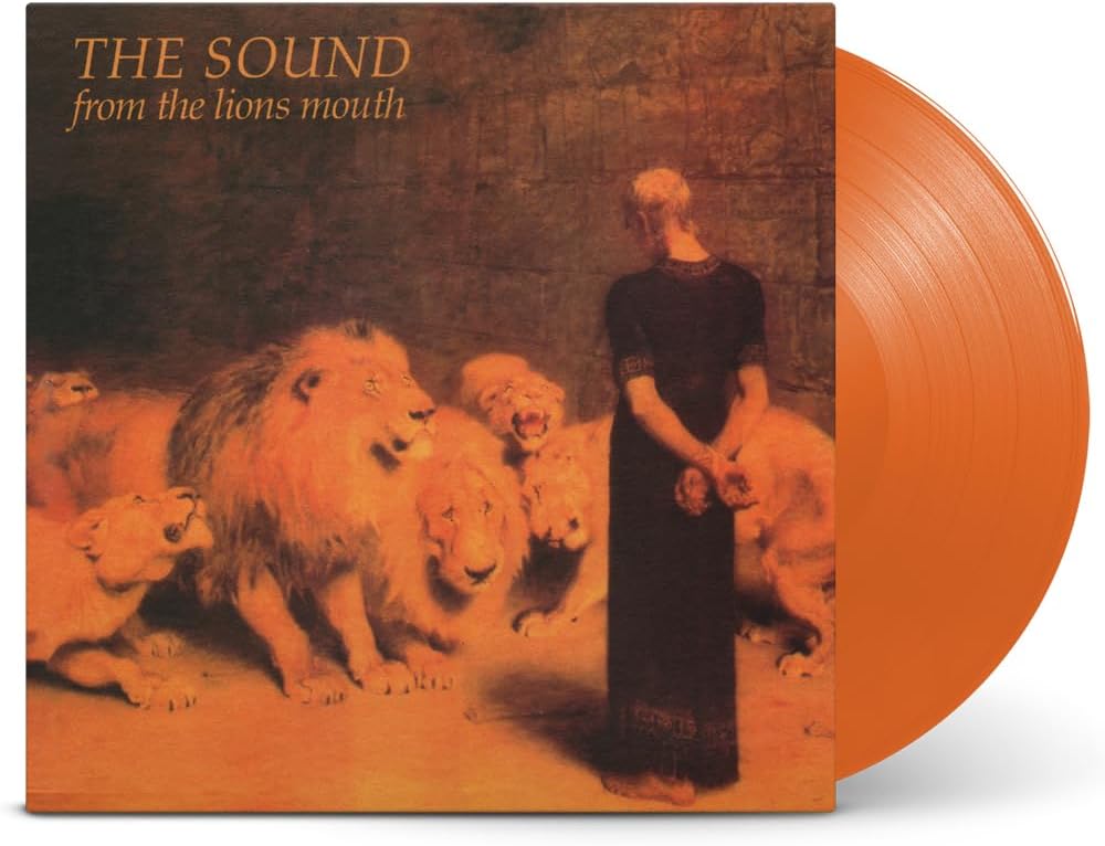 Vinyl record cover depicting lions and a woman in a dark dress.