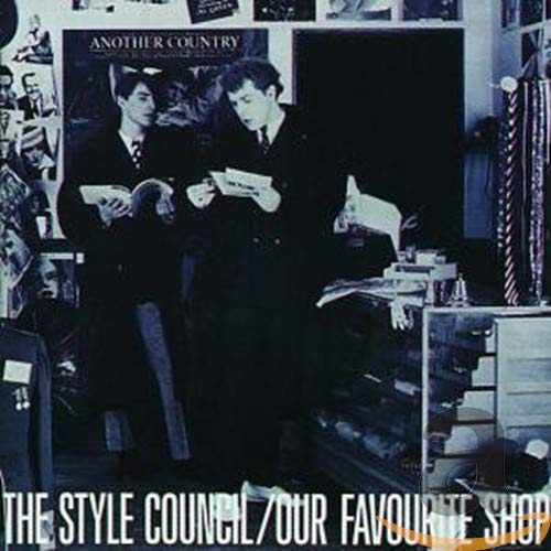 CD cover: two men in suits reading newspapers in a shop.